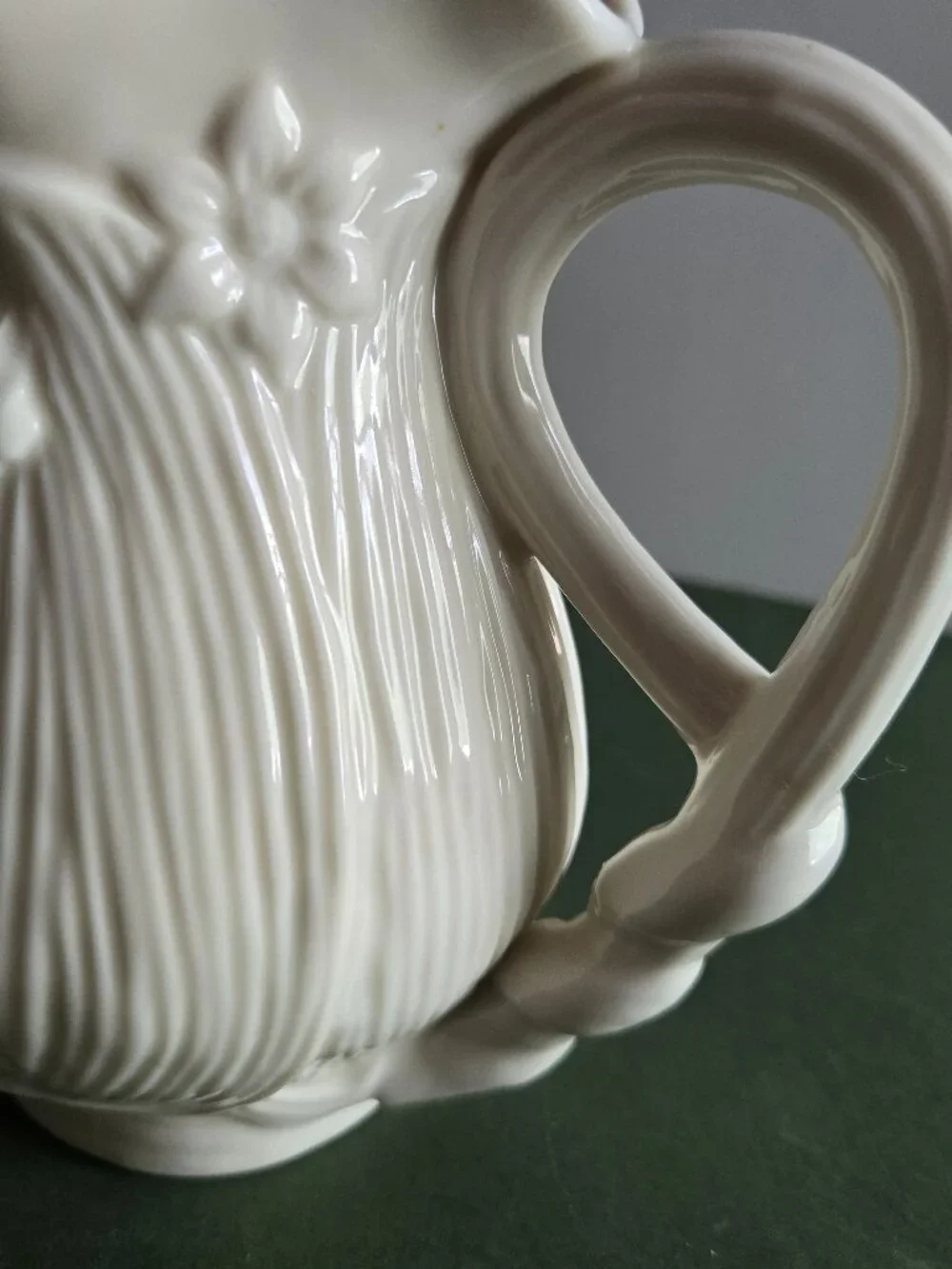 Pair of Ivory Bisque Pitchers